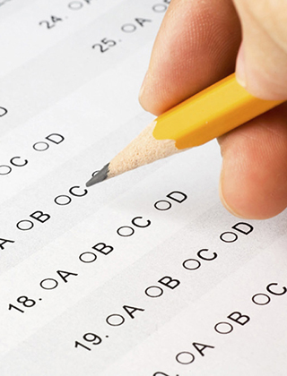  Pencil filling in test bubbles.